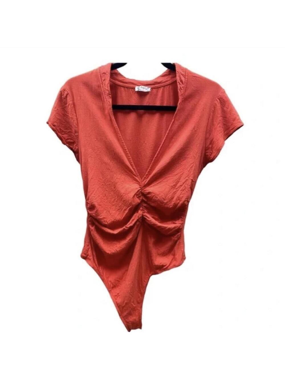 Ruched orange free people short sleeve body suit.